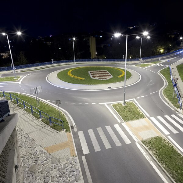 Night illuminated roundabout with different road and pedestrian marks where vehicles can be tested 